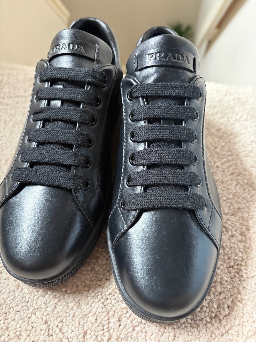 Prada woman’s Black Leather Low-Top Sneakers.